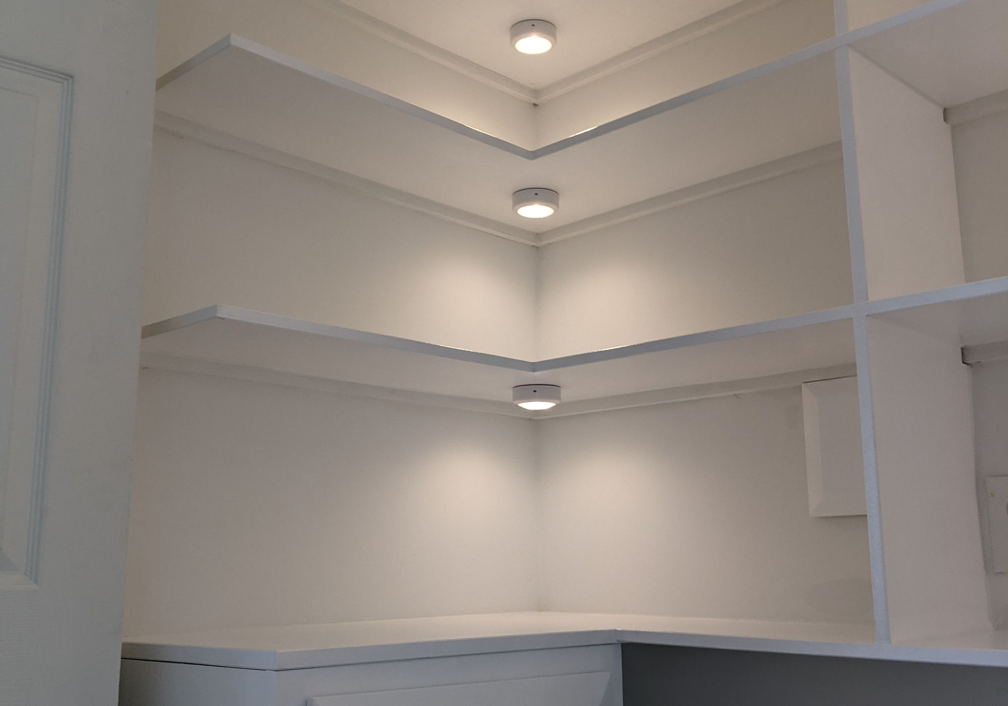 White corner built-in shelving