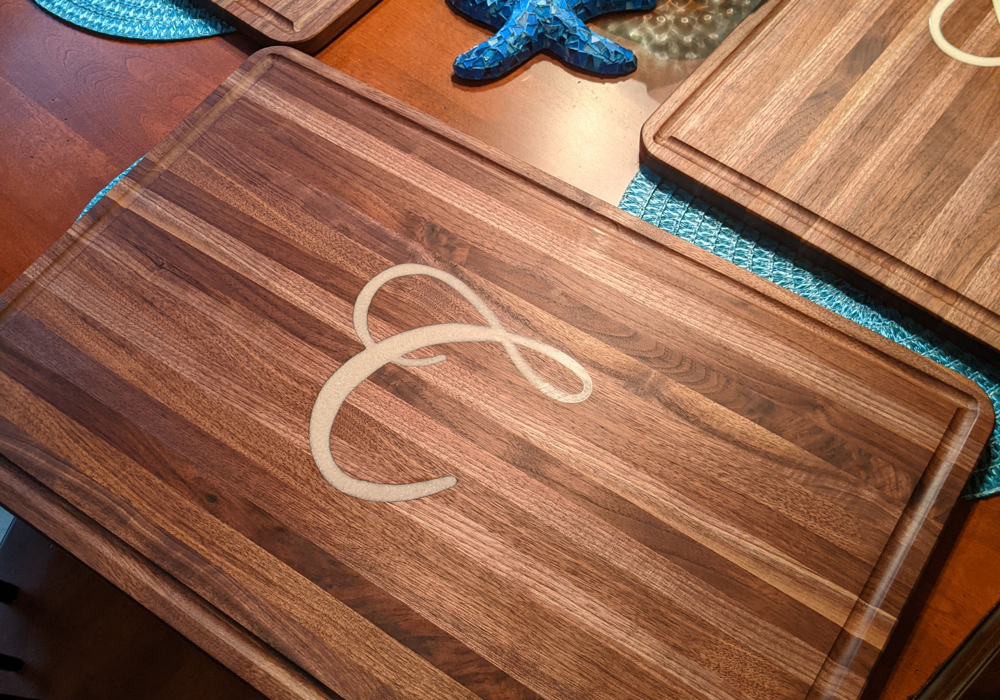 Walnut cutting board with monogram inlay